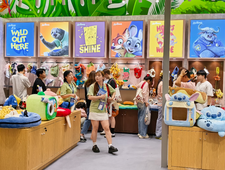 Colourful character-themed pet accessories and plush display at a pet exhibition