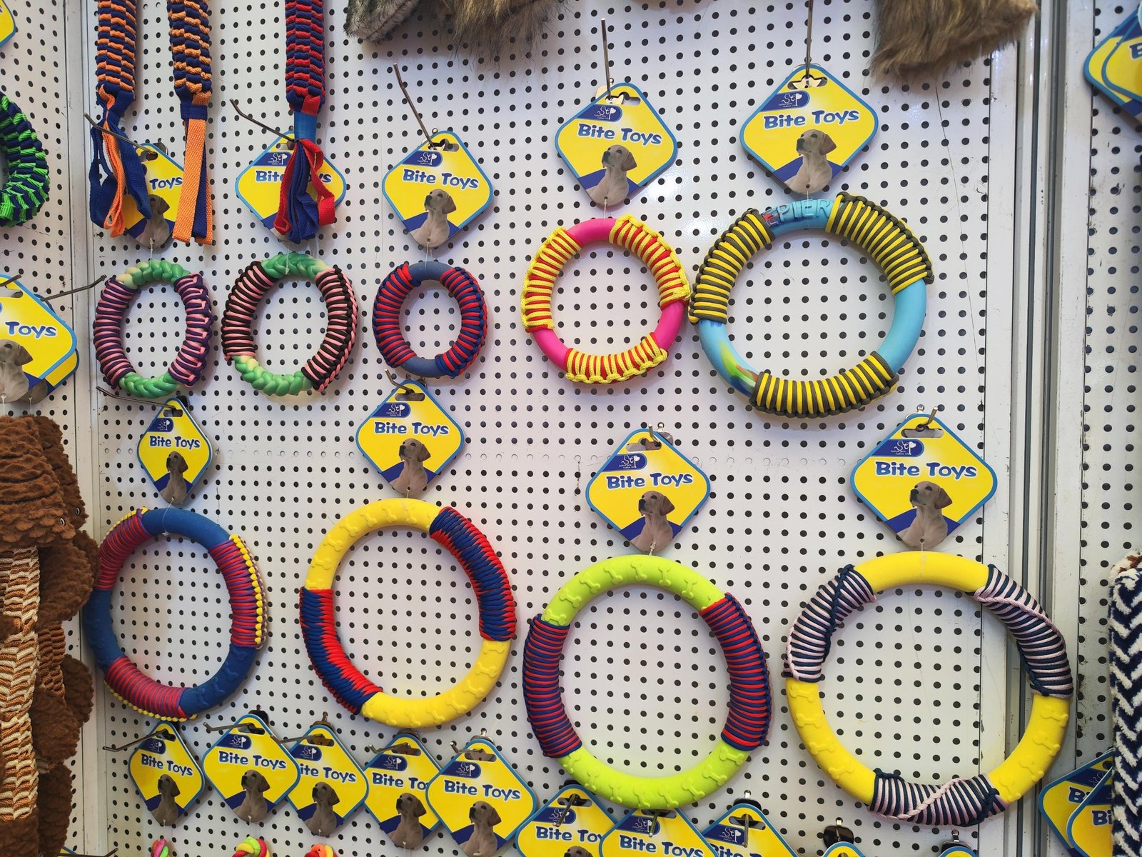 Colourful rope and chew toys displayed at a pet trade fair