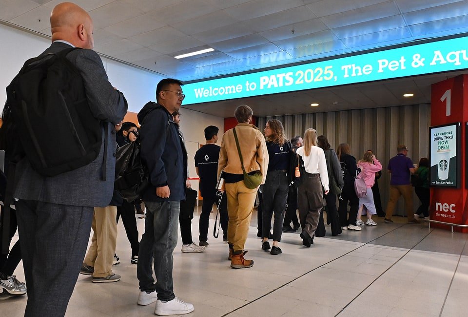 Figure 2. The PATS 2025 welcome banner and Hall 1 entrance at the NEC Birmingham. Field photo from the author's on-site collection, PATS 2025.