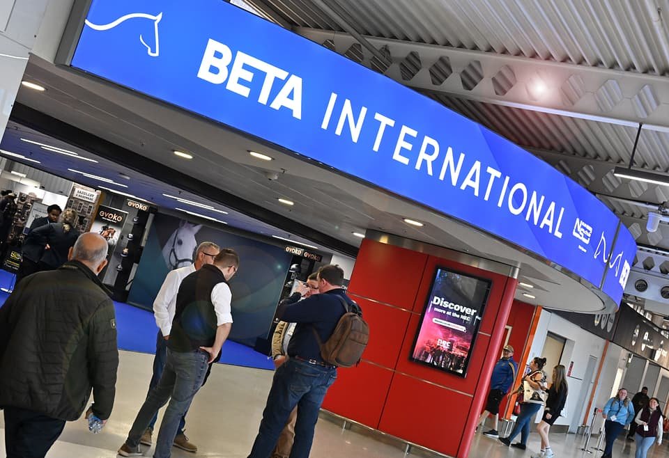 Figure 5. The illuminated BETA International entrance at the NEC, with NEC digital wayfinding visible. Field photo from the author's on-site collection, PATS 2025 (co-located event).